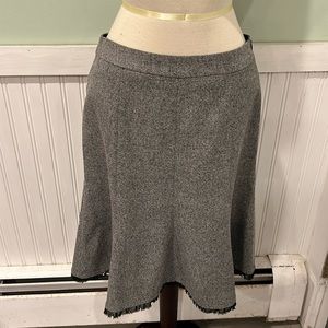 White / Black size 2 color gray skirt lined with a small ruffle at the hem.